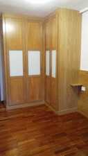 dormitorio roble 2 armarios y cabecero corrido